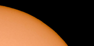 ISS flying in front of the sun