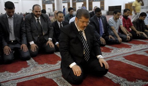 Mohammad Morsi (August 8, 1951- June 17, 2019) the fifth elected President of Egypt (June 30, 2012 – July 3, 2013) leading prayer (Photo: AFP: 2012)