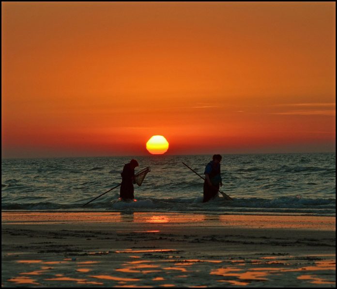 Fishing by the sea in France